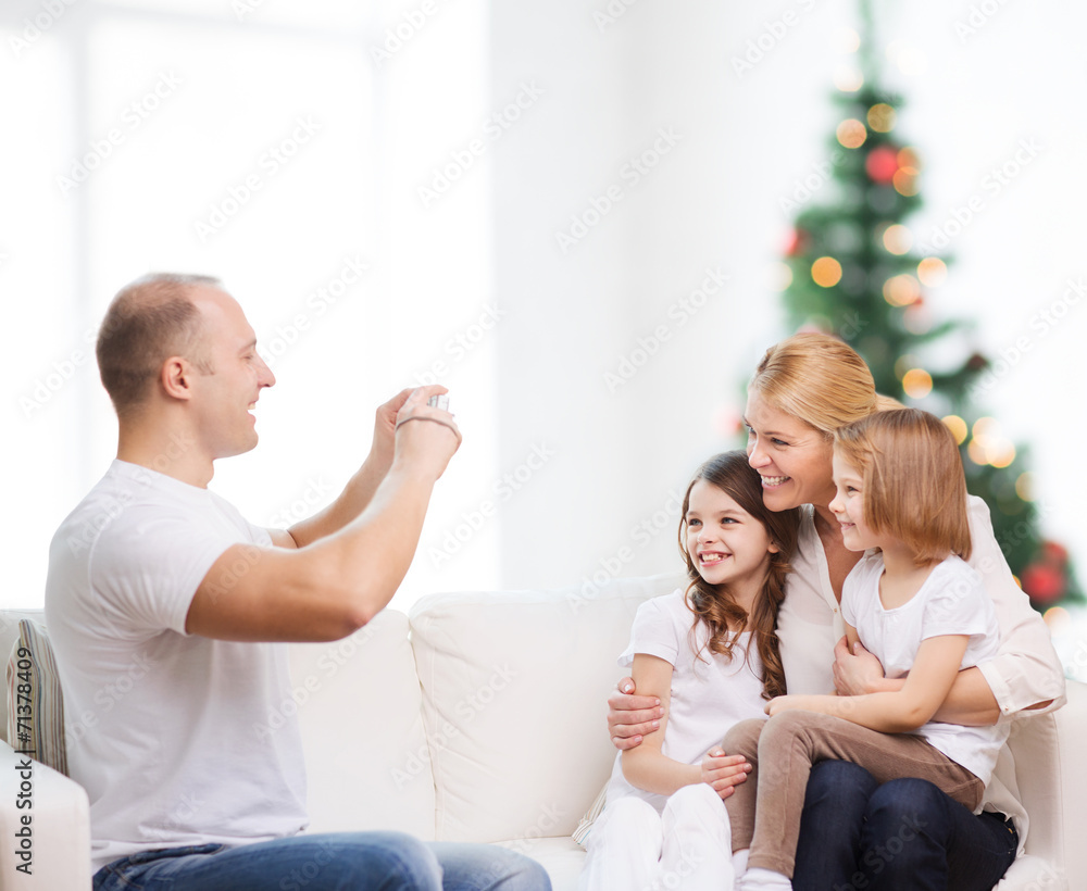 happy family with camera at home