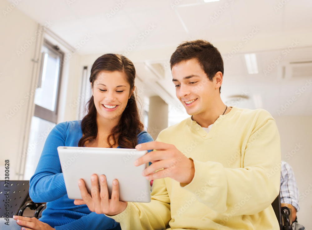 group of smiling students with tablet pc