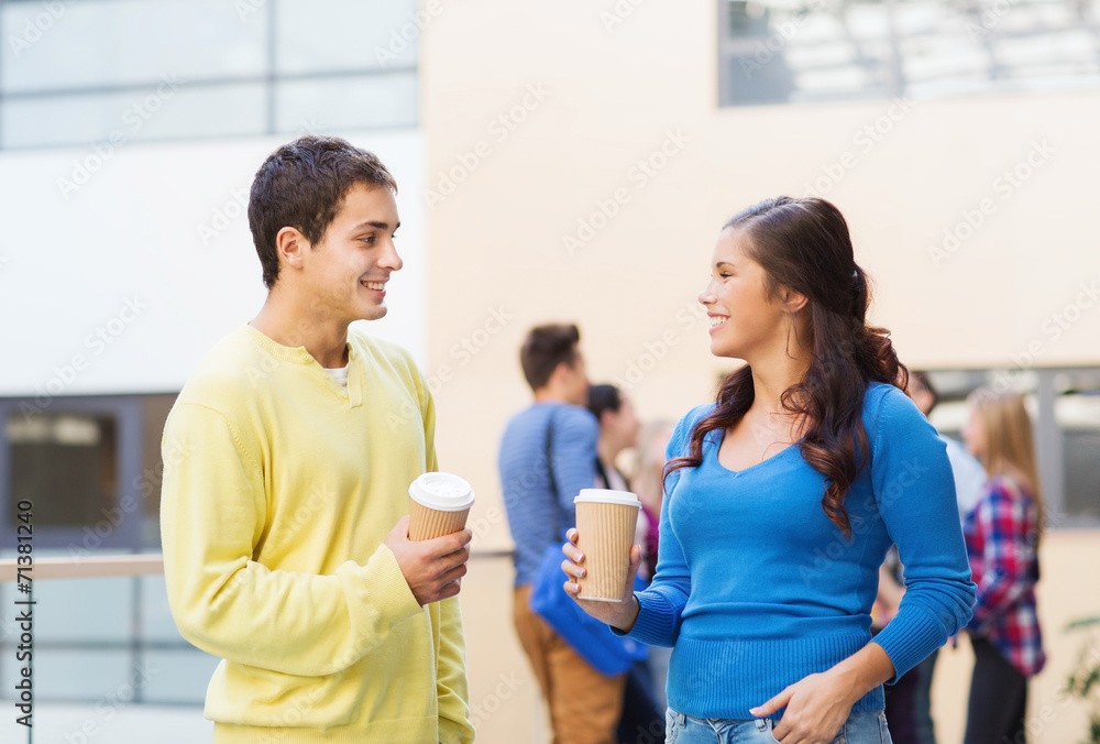group of smiling students with paper coffee cups group of smiling students with paper coffee cups