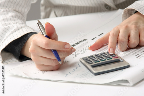 Business woman working with tax documents.