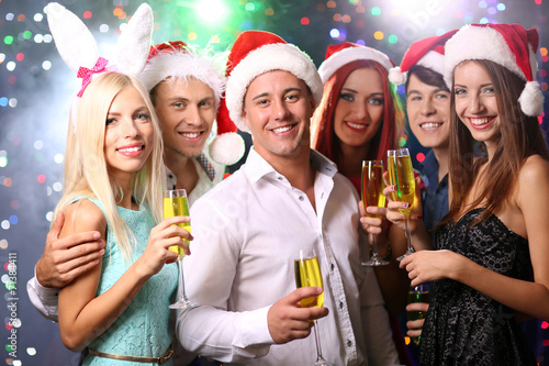 Young people celebrating Christmas in club