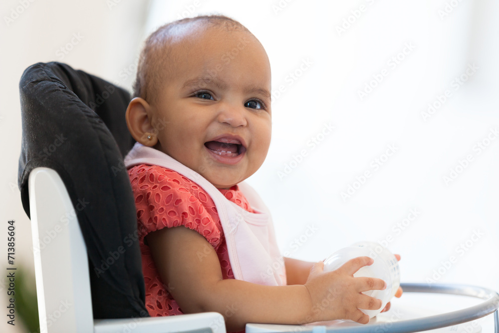 Portrait of little African American little girl holding her milk Portrait of little African American little girl holding her milk