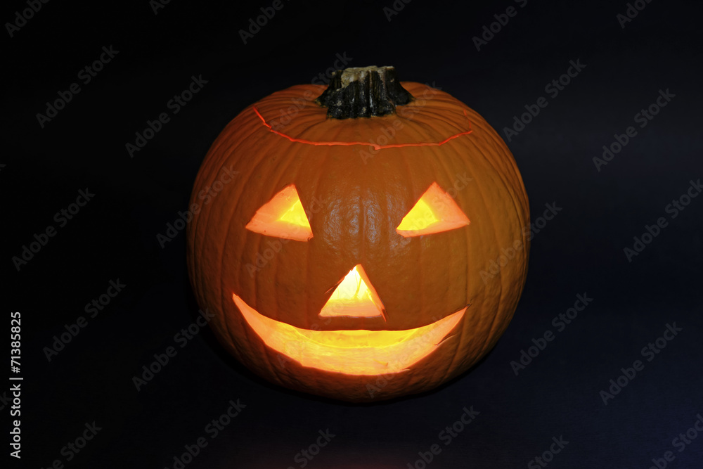 Halloween pumpkin carved into jack-o-lantern Halloween pumpkin carved into jack-o-lantern