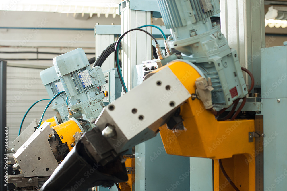 Modern factory equipment for production of boots Modern factory equipment for production of boots
