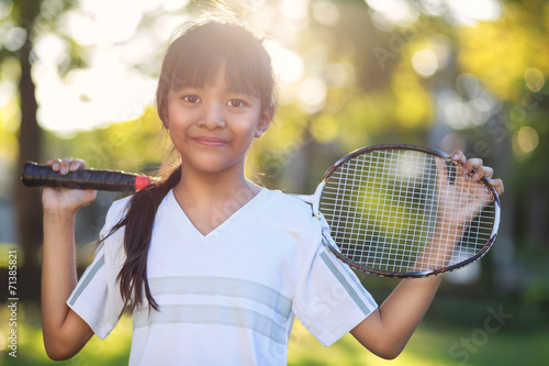 Little asian girl holding a badminton racket © Patrick Foto