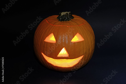 Halloween pumpkin carved into jack-o-lantern