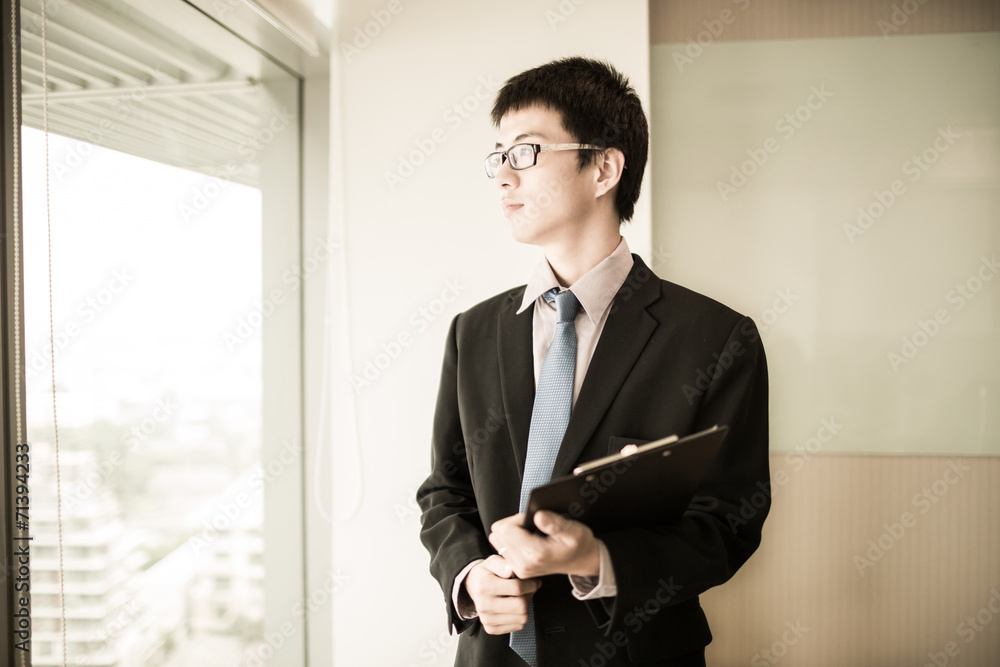 happy young business man work in modern office happy young business man work in modern office