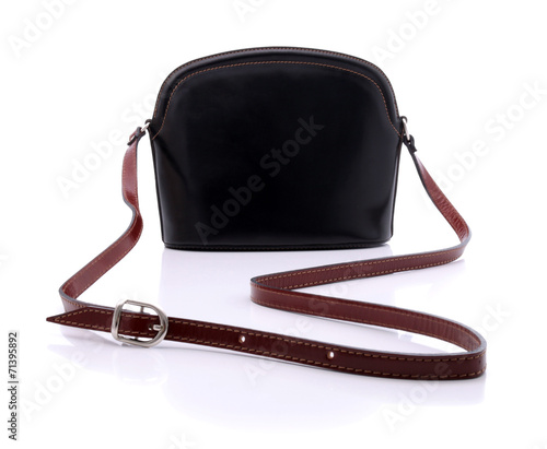 Black handbag on white back...