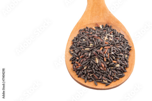 Black glutinous rice on a wooden spoon over white background