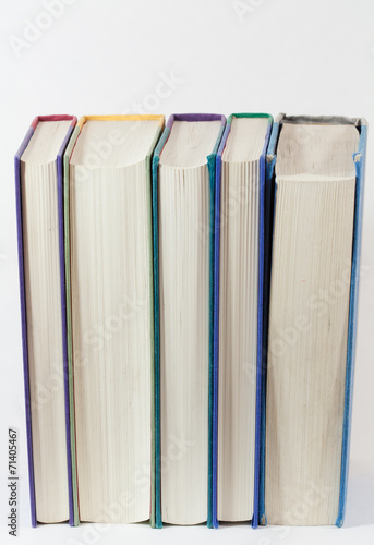 Books standing up vertical pages showing