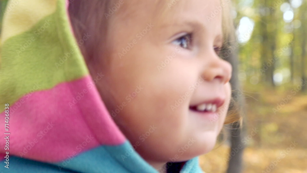 A small child touches the lens by hand. A small child touches the lens by hand.