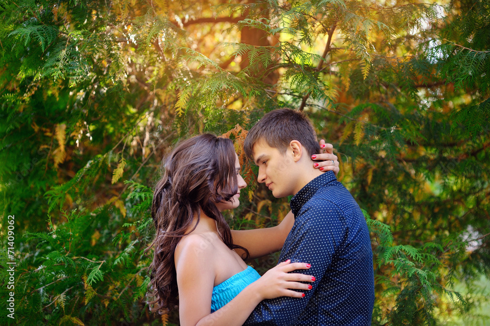 Fototapeta premium Young couple of lovers have fun in the park