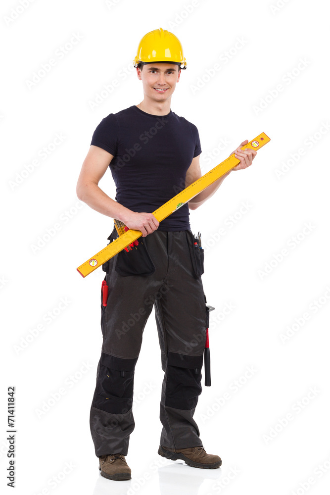 Manual worker holding a measuring instrument Manual worker holding a measuring instrument