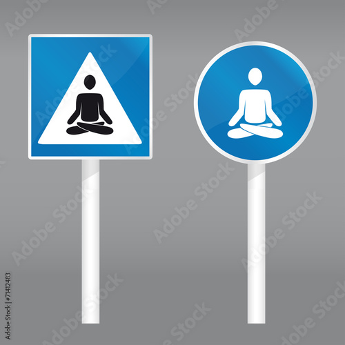 road sign with meditating person