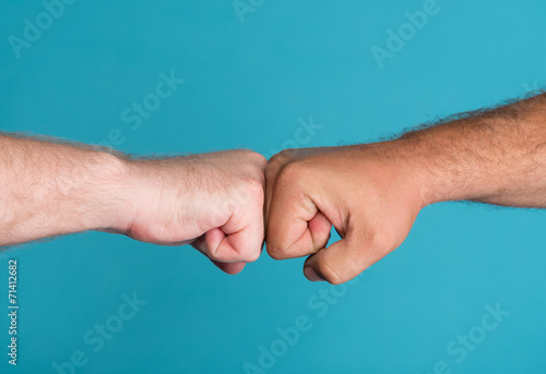 Two fists in confrontation