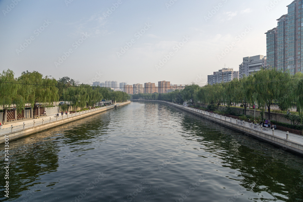China, Beijing. City landscape with the river and quay