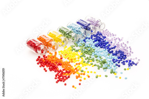 Tiny glass bottles filled with colourful beads