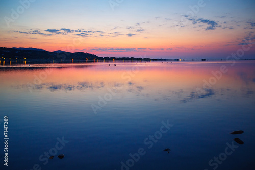 Beautiful sunset over water on Sardinia island