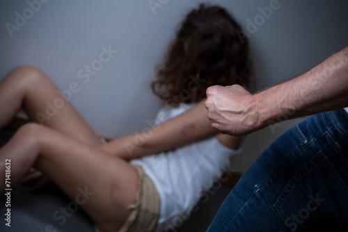 Beaten women on a floor