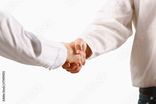 Closeup of a business handshake, isolated on white.