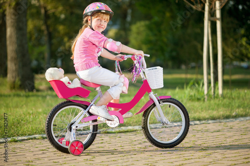  young girl on bike, active child concept