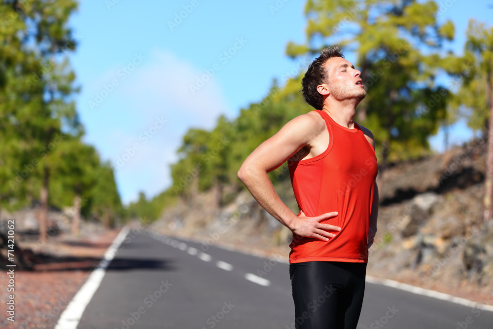 Runner resting tired exhausted after running Runner resting tired exhausted after running