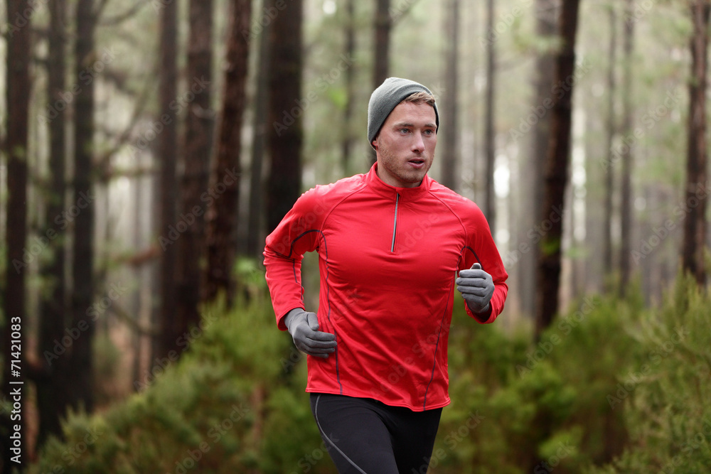 Running man in forest woods training Running man in forest woods training