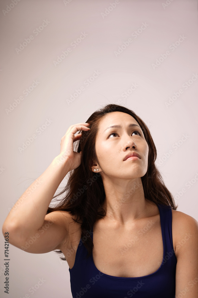 Fototapeta premium Asian chinese lady feeling puzzled