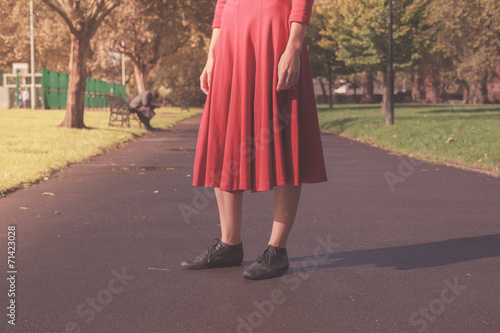 Young woman walking in the park