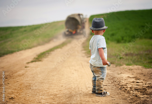 Little boy walking in nature