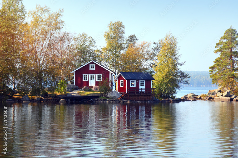 Naklejka premium .cottage on stone small island