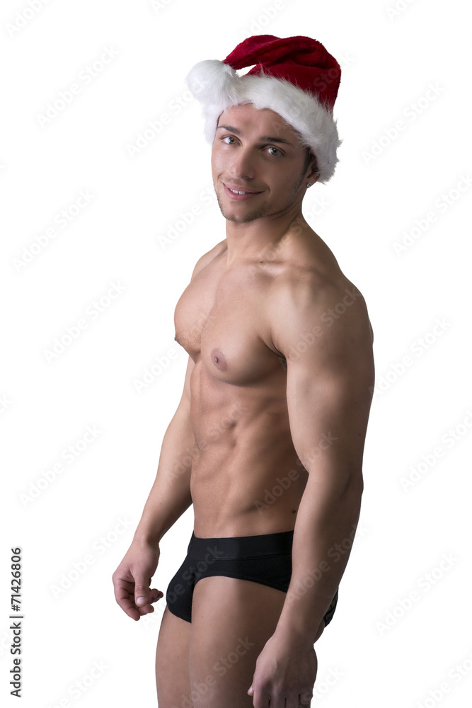 Christmas season: muscular bodybuilder in Santa Claus hat