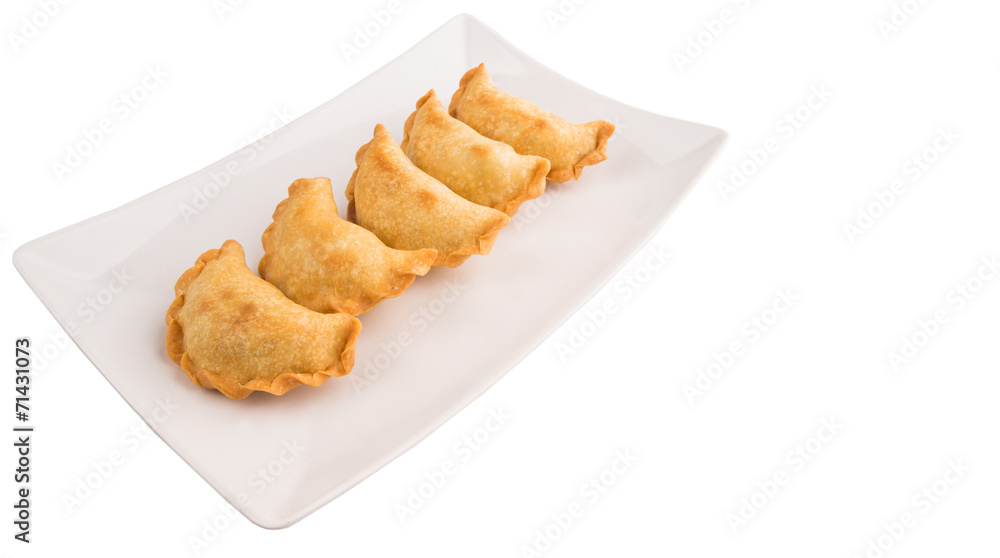 Popular traditional Malaysian snack curry puff on a white plate Popular traditional Malaysian snack curry puff on a white plate