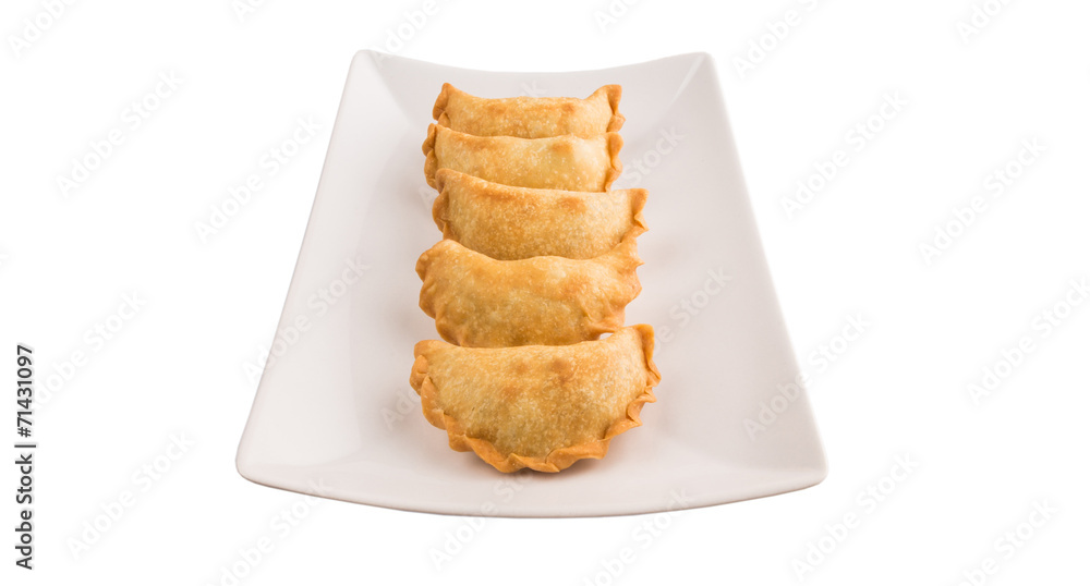 Popular traditional Malaysian snack curry puff on a white plate Popular traditional Malaysian snack curry puff on a white plate
