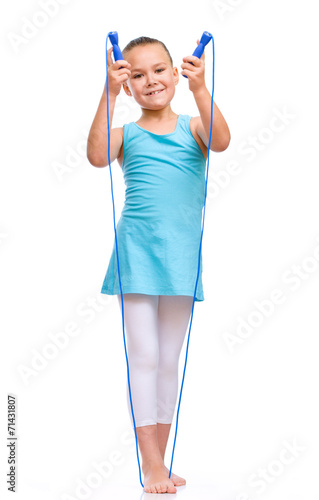Sporty girl with skipping rope