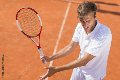Young man playing tennis © BGStock72