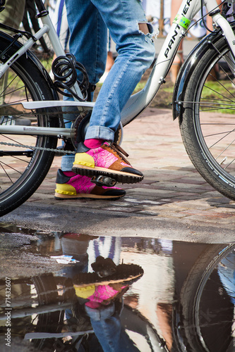 Stylish girl riding her city bicycle