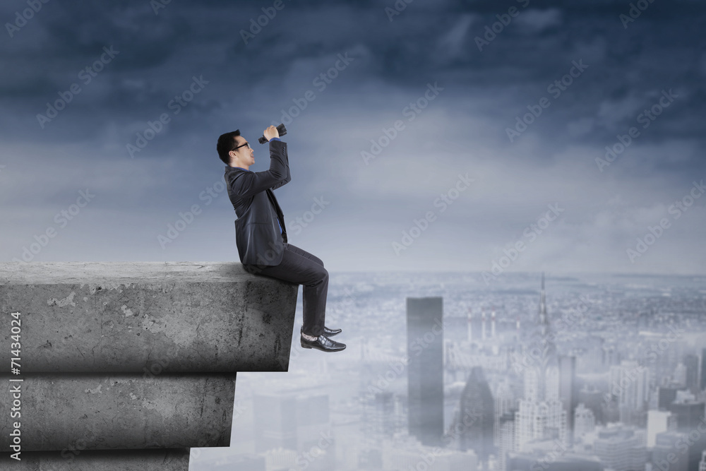 Businessman looking his vision on rooftop Businessman looking his vision on rooftop