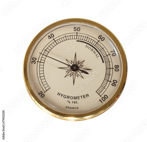 Foto Gold hygrometer with a white dial and needle to indicate humidity