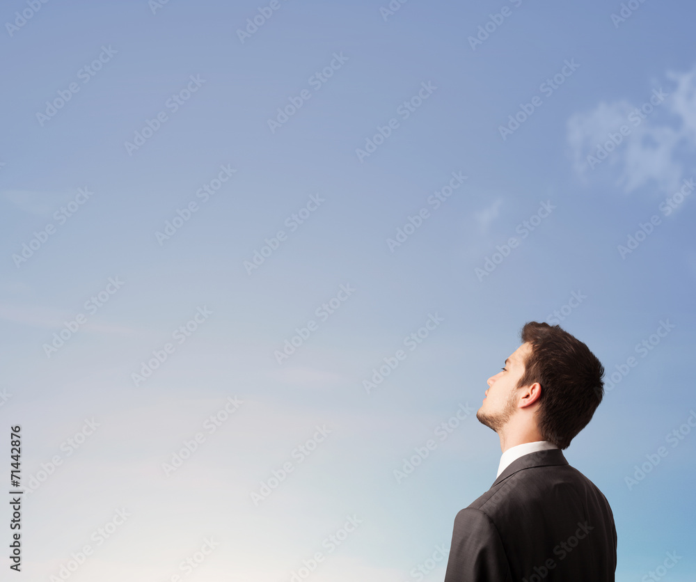 Handsome man looking at the blue sky copyspace Handsome man looking at the blue sky copyspace
