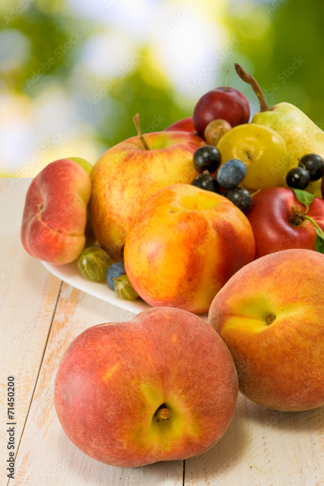 image of different fruits on a plate on a blurred background image of different fruits on a plate on a blurred background