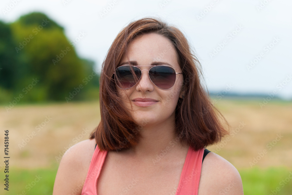 Young girl with sunglasses outdoors. Young girl with sunglasses outdoors.