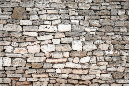 Ancient gray stone wall, background photo texture