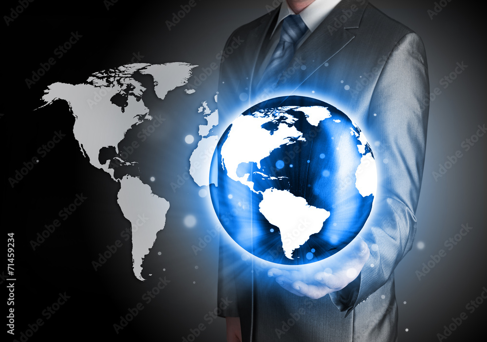 Fototapeta premium Businessman holds Earth in a hand