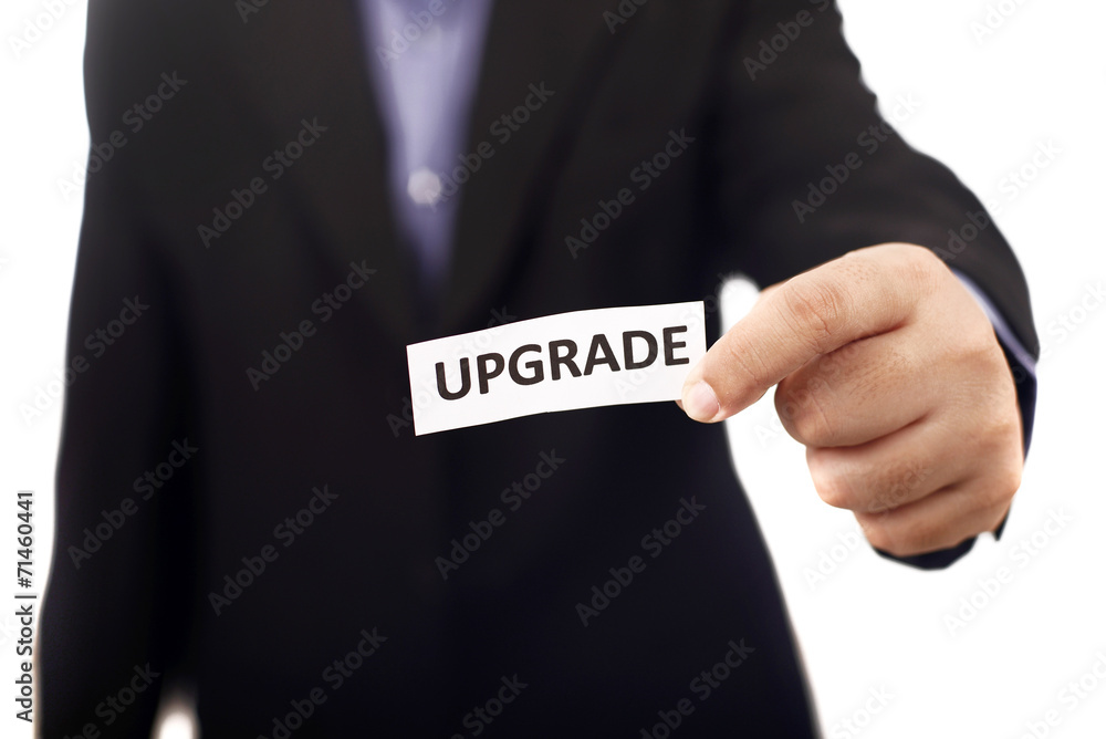 Man Holding Paper With Upgrade Text Man Holding Paper With Upgrade Text