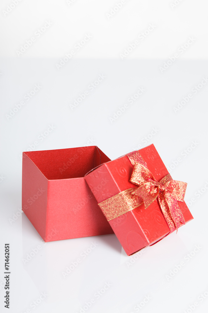 An empty red gift box with the lid off An empty red gift box with the lid off