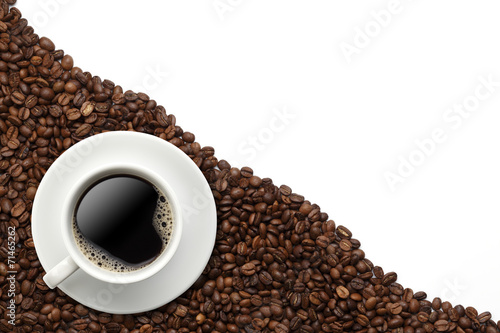 Cup of coffee on beans