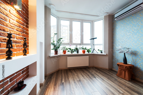 Fototapeta Naklejka Na Ścianę i Meble -  Spacious apartment - Brick wall in modern living room