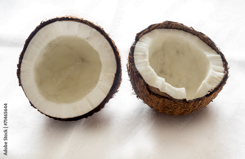 Coconut cut in half on white background Coconut cut in half on white background