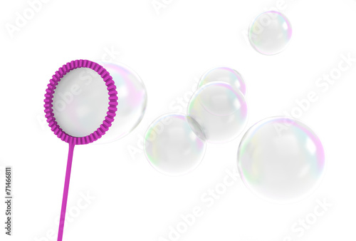 Reflective bubbles being blown from a wand toy photo